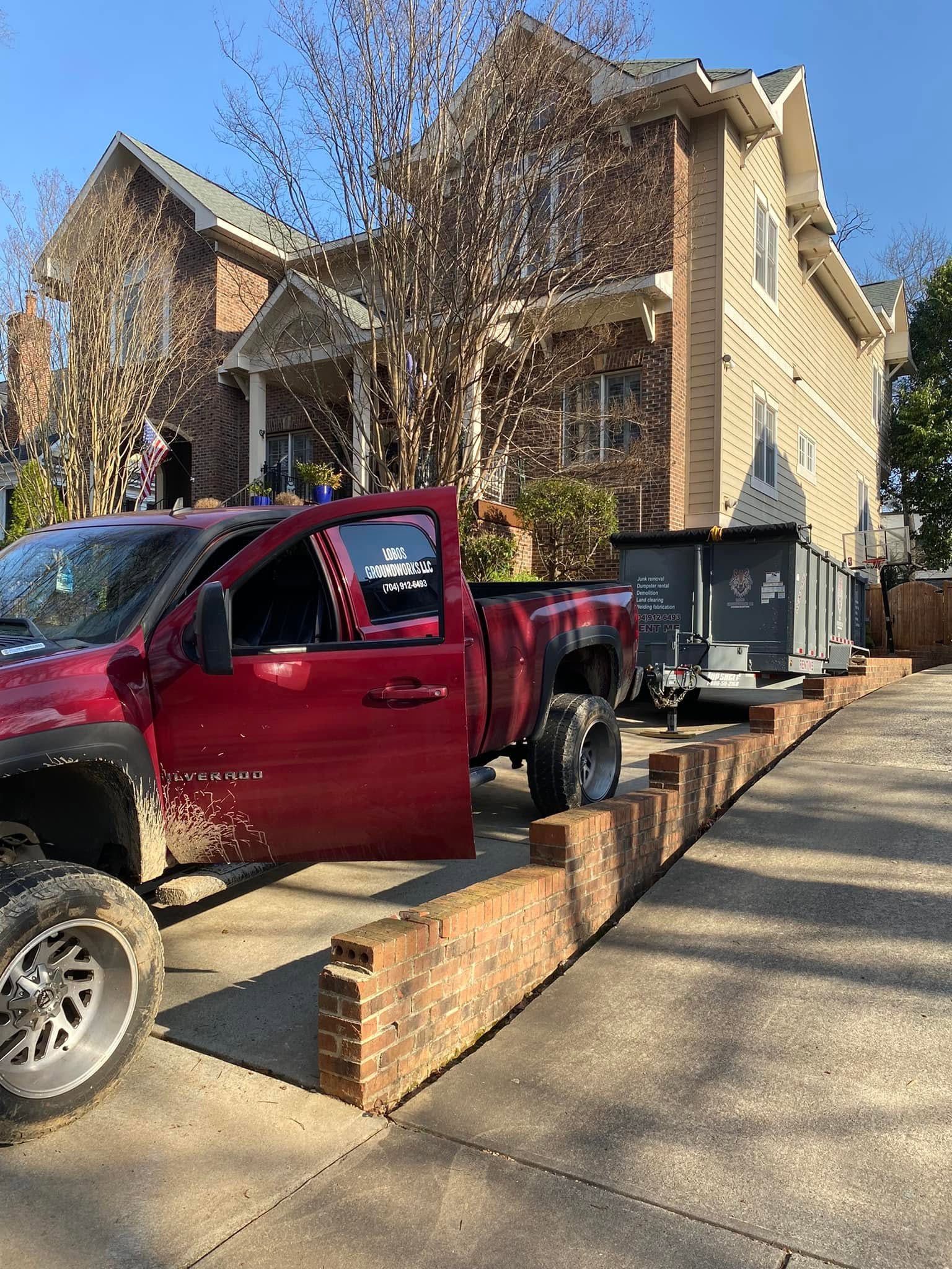 Dumpster delivered to a residential driveway